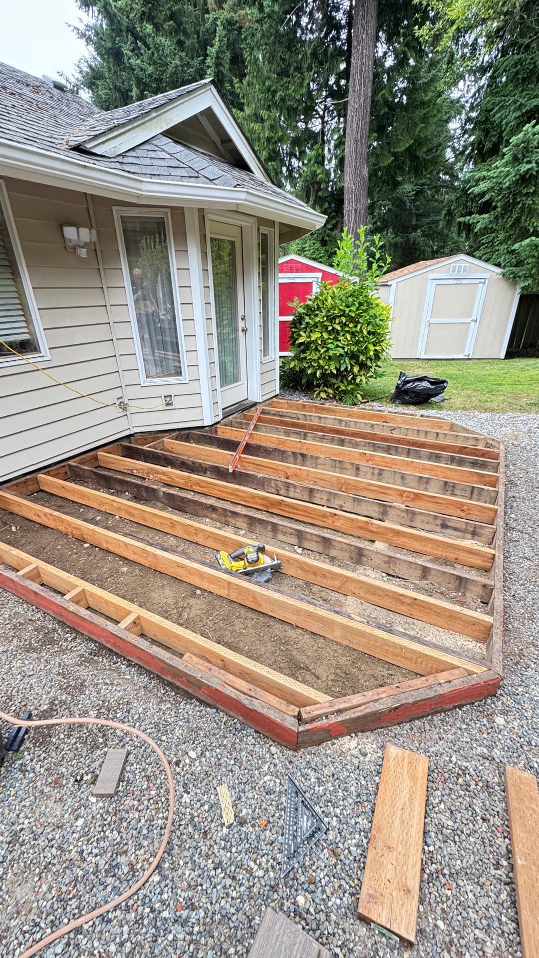 Pressure-treated joist framing during a deck build